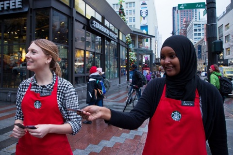 Starbucks “Give Good” squads will be out and about in their red and green aprons to deliver surprise gifts of $20 Starbucks Cards during community celebrations across the United States during the month of December. (Photo: Business Wire)