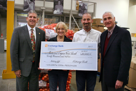 Exchange Bank President and CEO, Gary Hartwick, presents $20,000 check to David Goodman, CEO Redwood Empire Food Bank and Jean Larson, COO Redwood Empire Food Bank. Also pictured is Bill Schrader, Exchange Bank Chairman of the Board. (Photo: Business Wire)