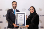 Dr Nawal Al-Hosany, Director of the Zayed Future Energy Prize accepts the GUINNESS WORLD RECORDS certificate for "Largest environmental sustainability lesson". (Photo: AETOSWire)