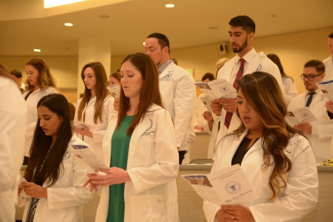 AUC medical students recite the modern oath of physicians at the White Coat Ceremony held January 15, 2018 on AUC's Sint Maarten campus. (Photo: Business Wire)