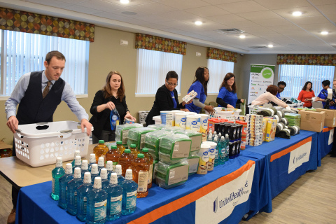 UnitedHealthcare employees and volunteers assemble “welcome baskets” to be donated to newly-moved in residents of New Parkridge, a new affordable-housing community in Ypsilanti. UnitedHealthcare is the largest investor in New Parkridge, providing $8 million to help build the new community (Photo: Nick Azzaro).