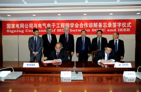 Representatives from IEEE PES and the IEEE China office, the International and Technical Departments of SGCC, and China Electric Power Institute attended the signing ceremony and discussions. (Photo: Business Wire)