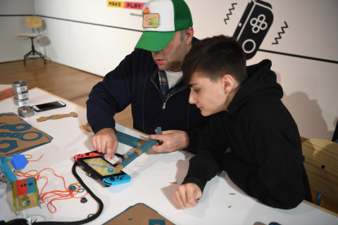 In this photo provided by Nintendo of America, kids enjoy making a Toy-Con Fishing Rod at an exclusive event in New York on Feb. 2, 2018. Toy-Con Fishing Rod is one of five different Toy-Con projects included in the Nintendo Labo Variety Kit, launching in stores on April 20. Nintendo Labo kits offer interactive build-and-play experiences designed to inspire creativity and discovery.