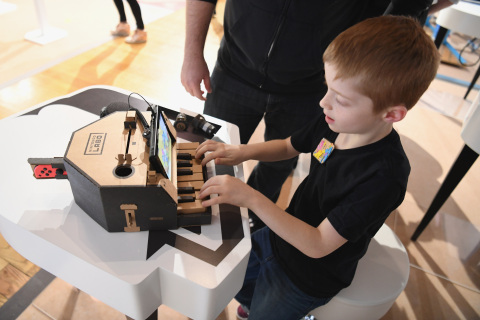 In this photo provided by Nintendo of America, kids enjoy playing tunes on a Toy-Con Piano at an exclusive event in New York on Feb. 2, 2018. Toy-Con Piano is one of five different Toy-Con projects included in the Nintendo Labo Variety Kit, launching in stores on April 20. Nintendo Labo kits offer interactive build-and-play experiences designed to inspire creativity and discovery.