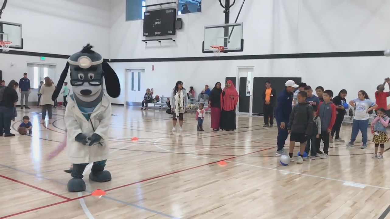 UnitedHealthcare donated 150 NERF ENERGY Game Kits to the Jackie Robinson Family YMCA as part of a national initiative to encourage young people to become more active through "exergaming." Ze Roberto, San Diego Sockers defender, and UnitedHealthcare mascot Dr. Health E. Hound, led members through exercises to test their new NERF ENERGY Game Kit that tracks activity earning "energy points" in order to play the game (Video: Anita Sen).