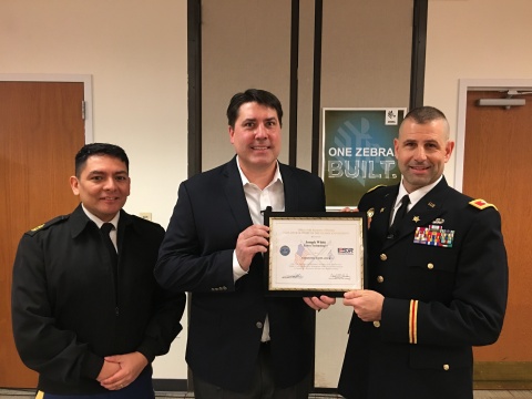 Col. Daniel Jaquint (right) and MSG Anthony Taylor, Public Affairs Specialist U.S. Army Reserve (left) present Zebra Technologies Senior Vice President Joseph White with the Patriot Award. (Photo: Business Wire)