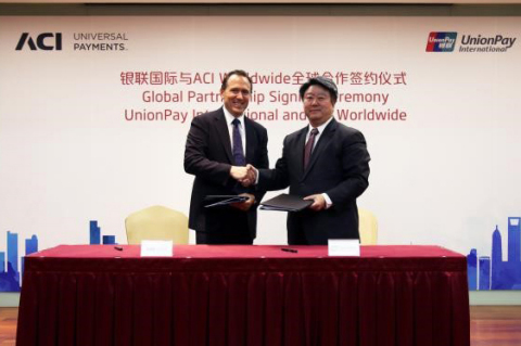 UnionPay International and ACI Worldwide signing ceremony in Shanghai; pictured: Mr. Cai Jianbo, CEO, UnionPay International and Dan Frate, group president, ACI Worldwide (Photo: Business Wire).