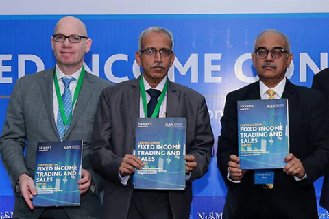 Ari Lehavi, Executive Director of Learning Solutions at Moody's Analytics, Gurumoorthy Mahalingam, Whole Time Member of the Securities Exchange Board of India (SEBI) and Sandip Ghose, Director of the National Institute of Securities Markets (NISM), launch the NISM-Moody's Analytics Certificate in Fixed Income Trading and Sales (CFITS) at the Moody's Analytics and NISM Fixed Income Conclave in March 2018.