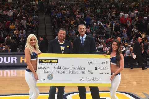 Western Union CEO, Hikmet Ersek presents $20,000 check on behalf of the Western Union Foundation to Bill Hanzlik, CEO and co-founder of the Gold Crown Foundation at Denver Nuggets game. (April 9, 2018) (Photo: Business Wire)