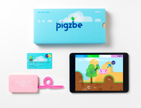 The Pigzbe kit contains the Pigzbe piggy wallet device and Pigzbe payment card that integrate with the Pigzbe game app. (Photo: Business Wire)