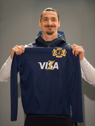 International football star Zlatan Ibrahimovic adds his own unique flair to his Visa jersey to annou ...