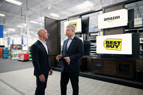 Amazon founder and CEO Jeff Bezos and Best Buy chairman and CEO Hubert Joly announce new Fire TV Edition smart TVs in Bellevue, WA. (Photo: Business Wire)