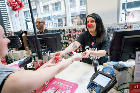 Walgreens customer purchasing a Sparkle Red Nose for $1 (Photo: Business Wire)