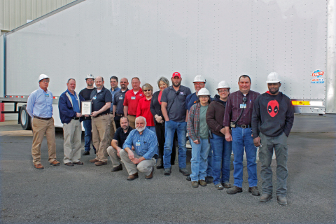Standing left to right: David Neighbors-Plant Manager, Dale Innis-Liberty Mutual, Chad Hale-Axle Line, Sean Graddy-EHS Manager, Chris Pindell-Materials Manager, Jeremy Dogan-Quality Control Manager, John Oliver-Plant Superintendent, Darla Smith-Accounts Payable, Suzie Watkins-EHS Clerk, Chris Clemons-EHS Department, Scott Taylor-Paint Tech., Monica Thompson-Front Walls, Laura Mayberry-AX, Ben Butler-EHS Tech., and Derrick Douglas-Material Handler. Kneeling left to right: Joe Upchurch-Fabrication/Process Improvement Manager, Scott Maxwell-HR Manager. (Photo: Business Wire)