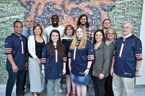 Symetra and the Chicago Bears celebrated the 16 Chicago-area teachers recognized as Symetra Heroes in the Classroom during the 2017 NFL season at a special reception at Halas Hall on May 18. Chicago Bears Linebacker Sam Acho (2nd left, rear row) was a surprise guest. (Photo: Business Wire)