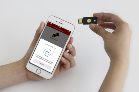 A user authenticates to their LastPass app on iPhone using a YubiKey NEO over near field communicati ... 