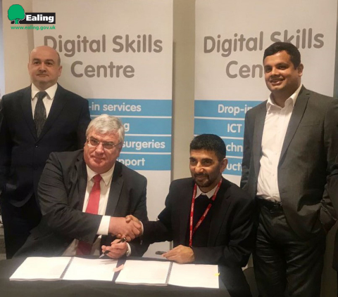 Edward Axe - Director ICT, IDM & CIO, Ealing Council (Left) with Pradeep Kar - Founder & CMD, Microland (Right), after signing the partnership (Photo: Business Wire)