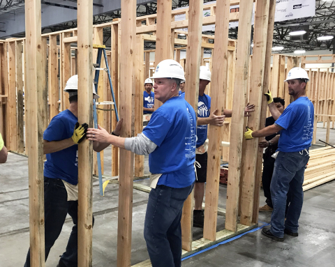 (Center) Scott Cannon, CEO at BigRentz, and team build a house frame for Habitat for Humanity of Orange County during Leaders Build. (Photo: Business Wire)