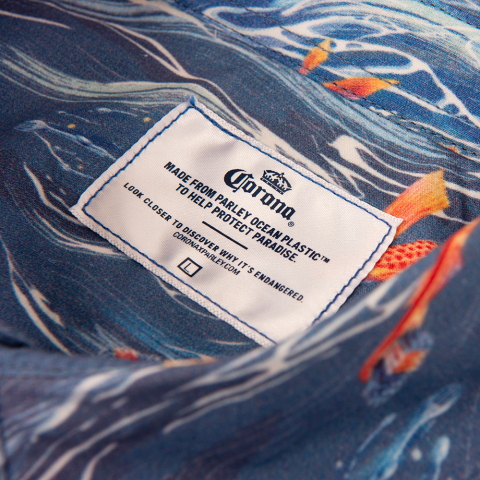 Corona and Parley for the Oceans redesign the Hawaiian shirt to spread awareness about the issue of marine plastic pollution this Oceans Week. The design features everyday plastic items and is made from Parley Ocean Plastic(TM) that is collected from the ocean.(Photo: Business Wire)