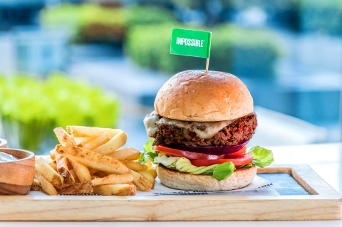 The Impossible Burger, served on a vegan bun, topped with gouda, onions and pickles, at Hotel ICON's GREEN. (Photo: Business Wire)