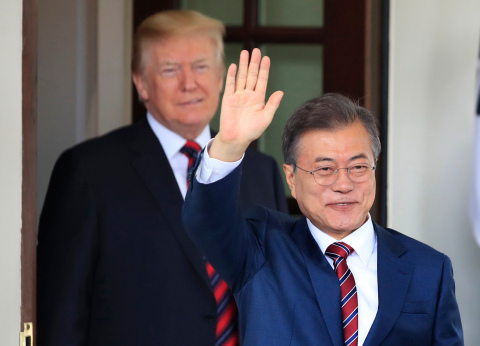 South Korean President Moon Jae-in waves as he is welcomed by President Donald Trump to the White Ho ... 
