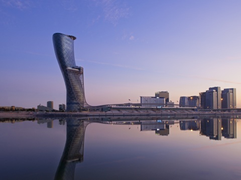 Exterior view of Andaz Capital Gate Abu Dhabi at sunset. (Photo: Business Wire)