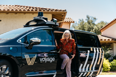 Another happy client alights from one of the many autonomous vehicles in the fleet. (Photo: Business Wire)
