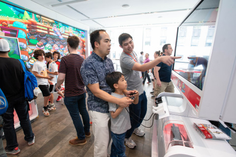 In this photo provided by Nintendo of America, fans gather at the Nintendo NY store in Rockefeller Plaza to celebrate International Sushi Day by eating sushi and playing the new Sushi Striker: The Way of Sushido game. An action-packed puzzle game that’s all about matching plates and eating sushi, Sushi Striker: The Way of Sushido is now available for the Nintendo Switch system and in 2D for the Nintendo 3DS family of systems. A free demo is also available in Nintendo eShop on Nintendo Switch – perfect for International Sushi Day on June 18! (Photo: Business Wire)