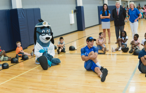 Tennessee Lt. Governor Randy McNally looks on as UnitedHealthcare pro-cyclist Travis McCabe and mascot Dr. Health E. Hound lead members of the Boys & Girls Club in series of healthy exercise as part of a fun-filled event in advance of U.S. Pro Road, Time Trial & Criterium National Championships, June 21-24 in downtown Knoxville (Photo: Erika Bentley).
