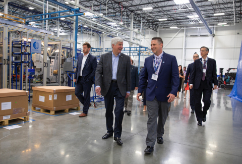 Cosworth facility General Manager Ken Gembel shows Gov. Snyder around the new advanced manufacturing facility. (Photo: Business Wire)