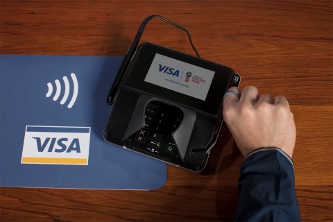 As the exclusive payment service in all stadiums where payment cards are accepted, Visa is providing fans in Russia the ability to purchase innovations for fast, easy and cash-free payment experiences. This includes partnering with Alfa-Bank to offer for purchase: 6,500 Payment Rings (3000 RUB each) and a 30,000 Payment Bands (1000 RUB each). The ring and the band are both NFC-enabled, contactless payment devices that link to a prepaid card. Visa is also offering fans Visa commemorative contactless cards. Consumers only have to load value onto their cards to begin using them, which they can do at Visa Alfa-Bank ATMs or through our online portal. (Photo: Business Wire)