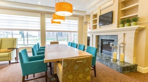 Family-size tables welcome groups in the lobby. (Photo: Business Wire)