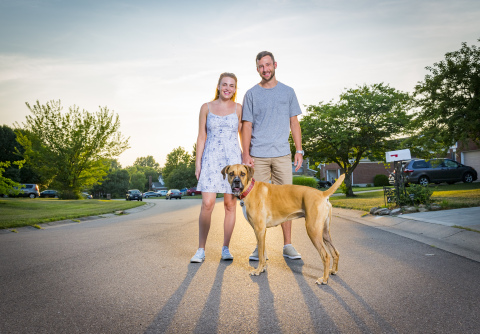 R.J. Leppert (pictured with his girlfriend Jenna Pierce and dog, Tucker) uses the Fifth Third Momentum app to help pay down his student loan debt. He says making an extra payment each month gets him closer to paying his loans off earlier. (Photo: Business Wire)