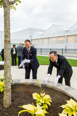 Valent Group Companies President, Andy Lee, and Sumitomo Chemical Company Health & Crop Sciences President, Ray Nishimoto, plant a tree to signify future prosperity for the companies’ biorational segment. (Photo: Business Wire)