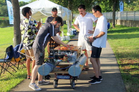 A RoboBoat team prepares their AV boat for competition. (Photo: Business Wire)