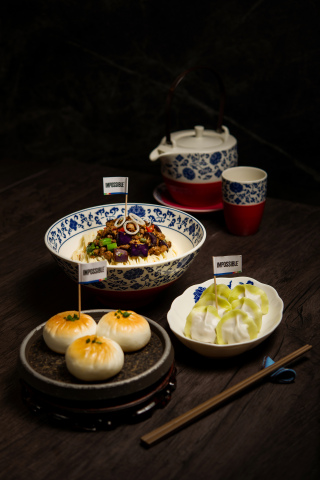 The Noodle Kitchen highlights Impossible meat in three traditional Chinese dishes: Seared Buns, Chive Dumplings, and Tossed Noodles with Spiced Eggplants. (Photo: Business Wire)