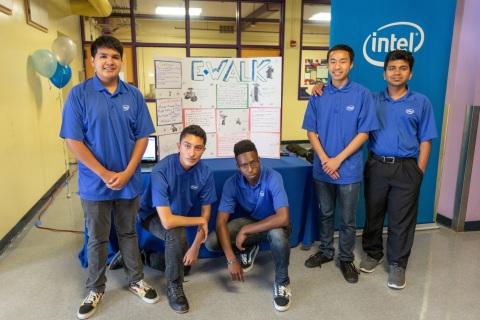 Intel interns (from left) Martin Reyes-Reyes, Cesar Lara-Ramirez, Pugna Som, Themba Mashama and Naziur Annan pose with their project E-Walk, a robotic guide dog for people with visual impairments. On completion of their six-week paid internships, 37 interns from Oakland Technical and McClymonds high schools presented projects, many incorporating Intel Corporation technology, to their families, schools and communities during a presentation in Oakland, Calif., on Thursday, July 26, 2018. (Credit: Intel Corporation)