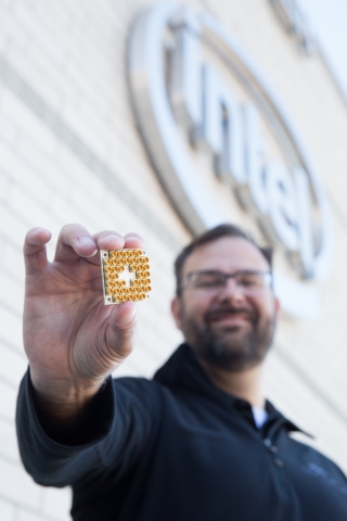 Intel’s director of quantum hardware, Jim Clarke, holds a 17-qubit superconducting test chip. (Credit: Intel Corporation)