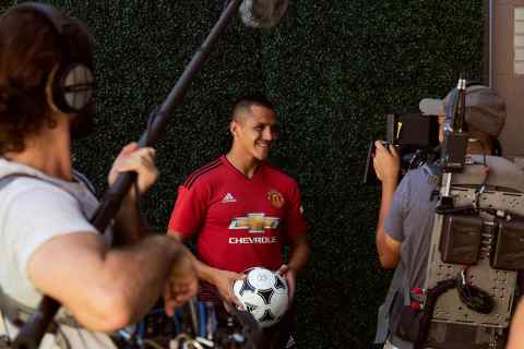 Manchester United forward, Alexis Sanchez, smiles down the lens during a Chivas film shoot in July in Los Angeles, United States. The film was released to announce Chivas as the "Official Global Spirits Partner" of Manchester United. Photographer: Monroe Alvarez