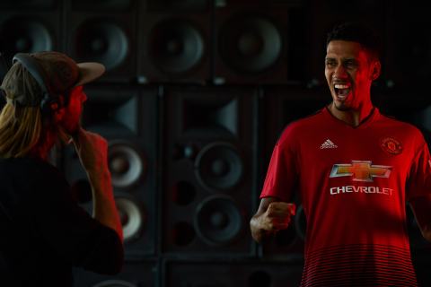 Manchester United defender, Chris Smalling, celebrates in front of a wall of speakers during a Chivas film shoot in July in Los Angeles, United States. The film was released to announce Chivas as the "Official Global Spirits Partner" of Manchester United. Photographer: Monroe Alvarez 