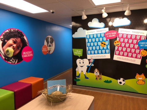 Bold graphics and a "selfie" wall make going to the dentist fun for children who visit the new Western Dental Kids office in downtown Modesto. (Photo: Business Wire)