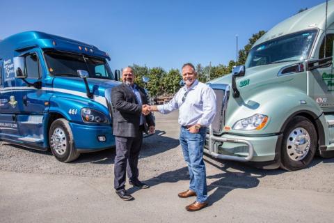 Ron Riddle, CEO of Leavitt's Freight Service (left), joins Rick Williams, CEO of Central Oregon Truck Company (right), as a member of the Daseke family. (Photo: Business Wire)