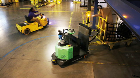 At FedEx Ground hubs, high-tech helpers work alongside team members for maximum efficiency. At the hub in Greensboro, North Carolina, self-driving tuggers move large or overweight packages. We’re also testing automated devices that can unload trucks. (Photo: FedEx Corporation)
