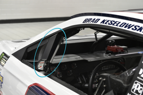 Customized carbon-fiber-filled Nylon 12 mirror housing installed on #22 Discount Tire car. The composite's stiffness prevents the mirror housings from flexing under the aerodynamic loads produced on track. (Photo: Team Penske)