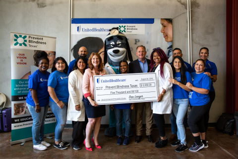 Don Langer, CEO, UnitedHealthcare Community Plan of Texas (center right) and employee volunteers present check to Heather Patrick, CEO, Prevent Blindness Texas (center right) at a back-to-school health event at the BakerRipley Leonel Castillo Community Center in Houston. The event is part of a grant program from UnitedHealthcare to nonprofits in cities across the country to coordinate free vision screenings, comprehensive eye exams and eyeglasses donations. Prevent Blindness Texas received a $5,000 grant for the local event (Photo: Pu Ying Huang).
