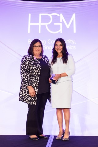 Patricia Contreras, left, director of the Rockwell Automation Charitable Corporation, accepts “Corporation of the Year” award from Griselda Aldrete, president and CEO of Hispanic Professionals of Greater Milwaukee. (Photo: Business Wire)