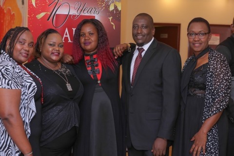 (M) Jane Atieno flanked by Debra Koriata (clinical officer Mtongwe H.C) and Joseph Mositet at the AHF Kenya 10th anniversary gala dinner. (Photo: Business Wire)