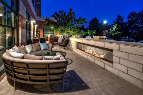 As the evenings get cooler, guests can gather around a fire pit on the patio. (Photo: Business Wire)