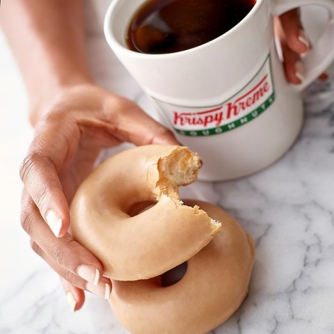Krispy Kreme Doughnuts introduces the new Coffee Glazed Doughnut and Original Glazed™ Coffee available beginning Sept. 24. In addition to enjoying both new products throughout the week, java lovers can grab a FREE Krispy Kreme coffee, any size, on National Coffee Day, Sept. 29 at participating locations. (Photo: Business Wire)