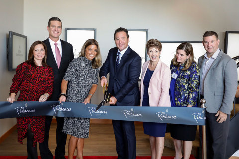 Mark Wang, president and CEO, (center) cuts ribbon with Hilton Grand Vacations' leaders. (Photo: Bus ... 